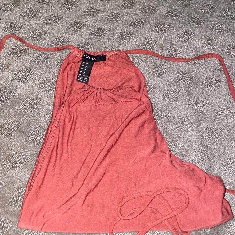 A orange/ burnt pink tie up shirt